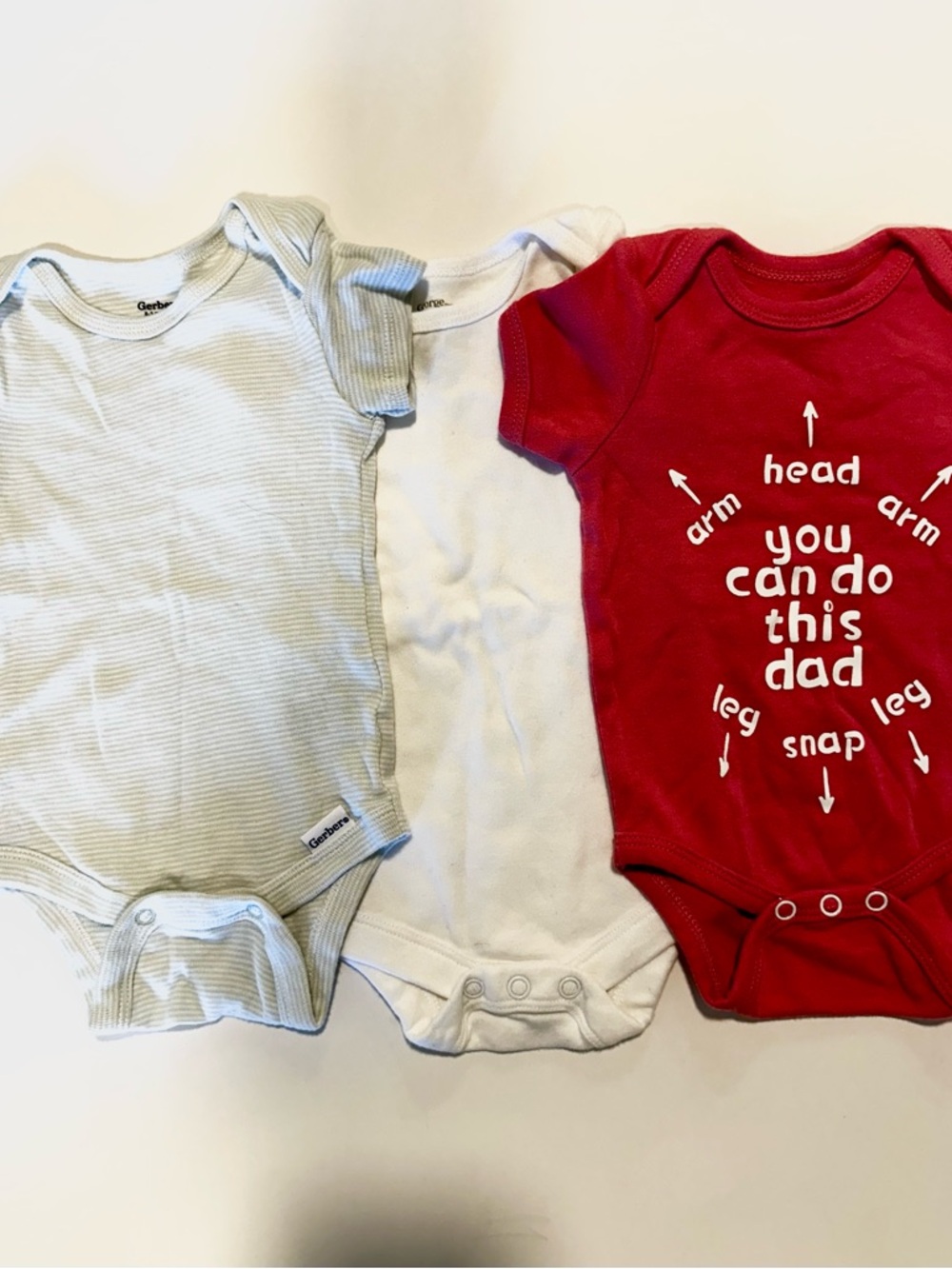 3 baby onesies